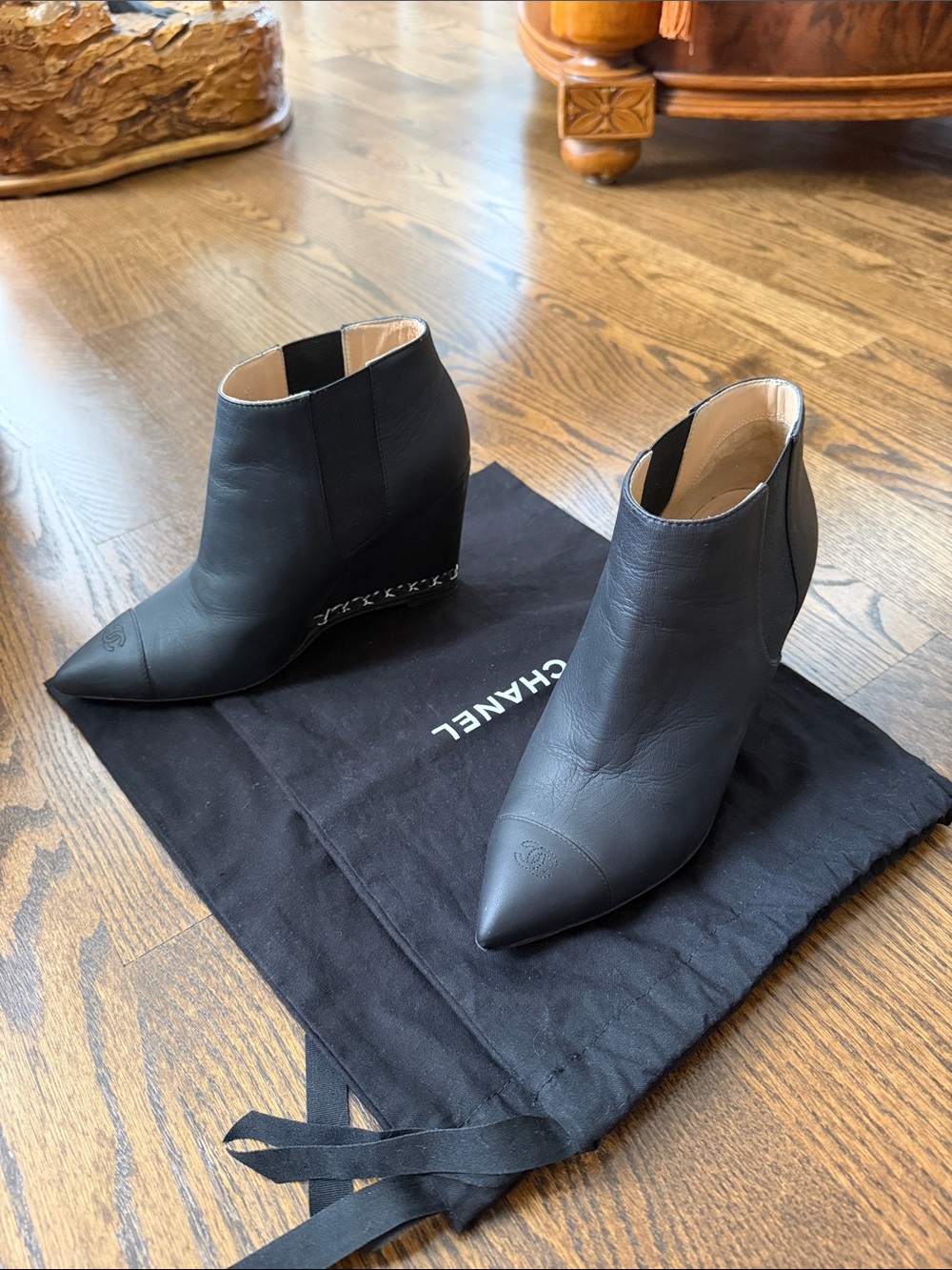 CHANEL Black Pointed Leather Wedge Ankle Boots with chain detail